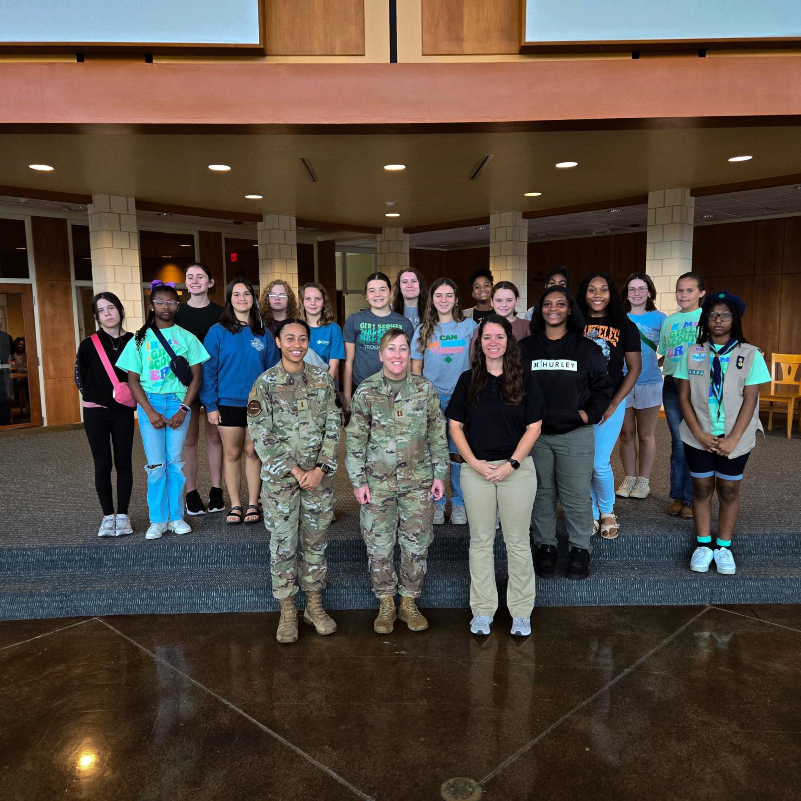 A picture of Girl Scouts and women leaders in STEM